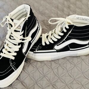 Vans Black and White High-Top Athletic Shoes